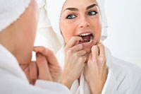 How to Stop Floss From Getting Stuck Between Your Teeth