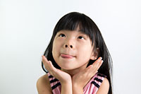 young girl sticking out her tongue