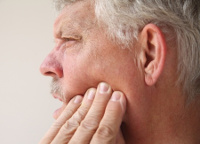 man with mouth pain