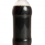 Bottle of soda illustrating one of the worst foods for dental health, highlighting high sugar and acid content.
