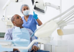 man at the dentist looking at a screen