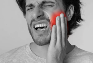 man with jaw pain